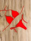Яркий красный купальник-шторки со стрингами на завязках 
