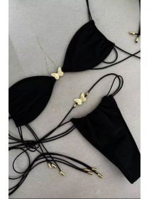 Чорний жіночий купальник на зав'язках із золотими метеликами 
