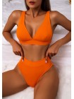 Оранжевый яркий купальник с высокими плавками в рубчик